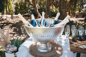 Luxe white circle arbour with neutral-colored dried florals against the ocean backdrop at Zoe and Deon’s Noosa wedding.