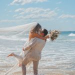 Zoe and Deon showcasing their love after their noosa wedding ceremony