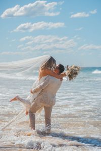 Zoe and Deon showcasing their love after their noosa wedding ceremony